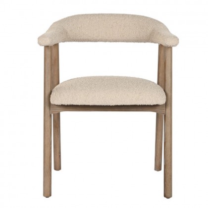 Silla comedor tapizada en poliéster color blanco roto con un acabado borreguito con reposabrazos.